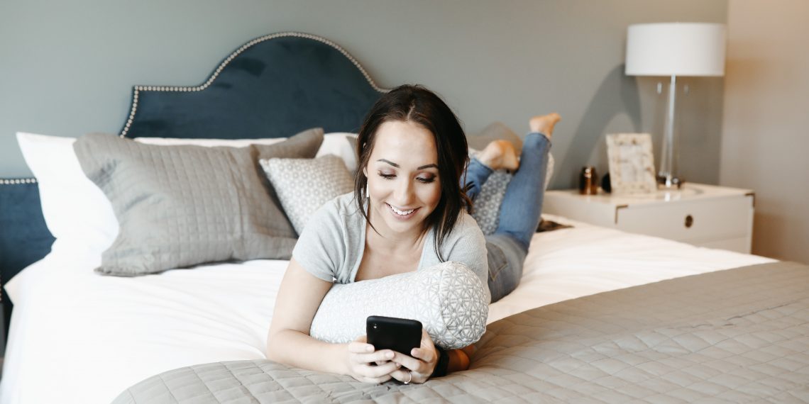 woman lying down on a mattress