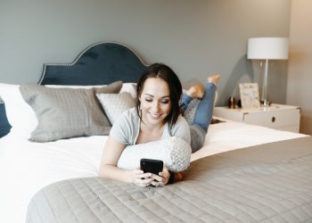 woman lying down on a mattress