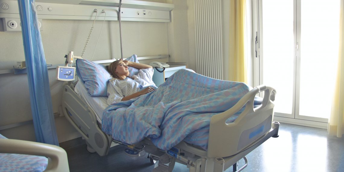 woman sleeping on a hospital bed